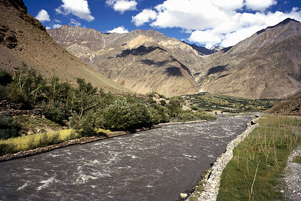 The Suru River in Ladakh is a vital 185 km tributary of the Indus, originating from the Penzi La glacier and creating the lush, green Suru Valley in the otherwise arid Kargil district, known for its stunning views of the Nun-Kun peaks, white-water rafting, and distinct cultures, serving as a fertile region with villages like Sankoo and Panikhar.
