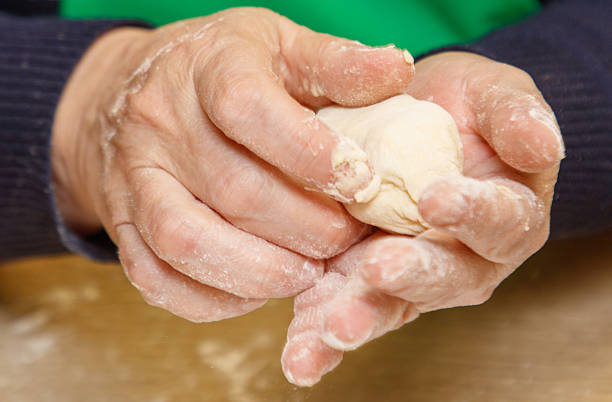 istock A person is making a dough with their hands 2254127266