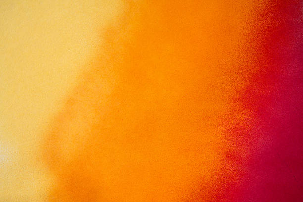A background painted with warm color gradient spray paint