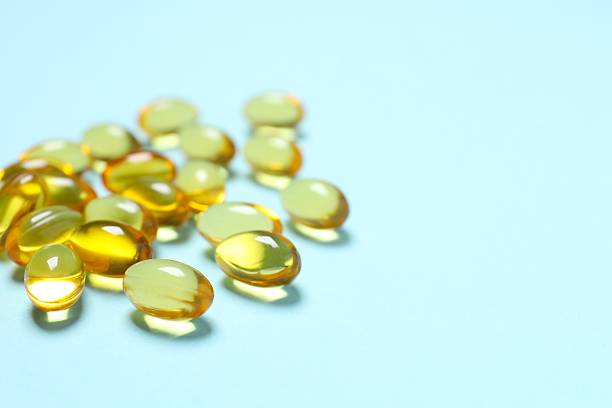 istock Fish oil tablets. Biologically active additives. Omega 3, 6, omega 9, vitamin A, E, D 2254129679