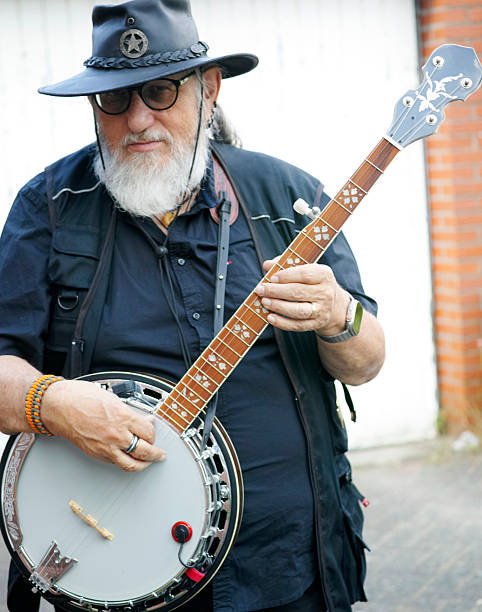 istock Senior man plays a banjo 2254130057
