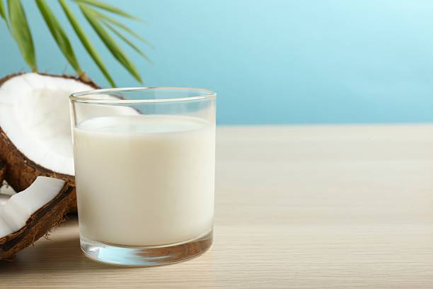 istock Glass of milk with coconuts on the table 2254130395