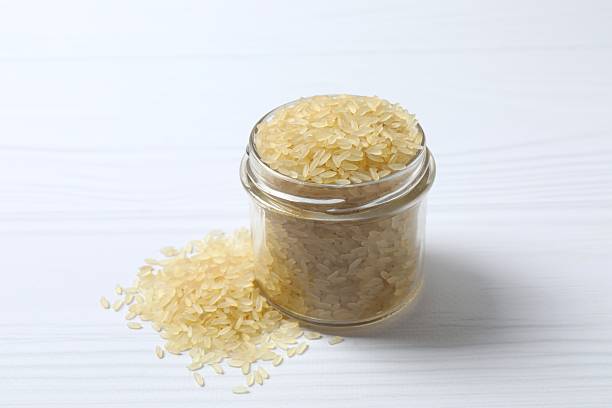 istock Raw brown rice in a jar on the table 2254131311