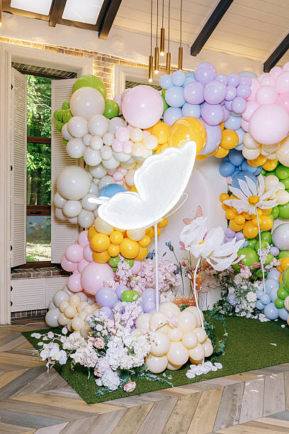 istock A whimsical balloon arch backdrop adorned with a vibrant neon butterfly design, perfect for adding a touch of flair and charm to a variety of celebratory events and gatherings for all ages 2254132502