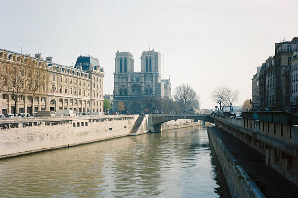 Paris, France - June 01, 1992: Historical view of Notre Dame cathedral before the fire seen from river Seine