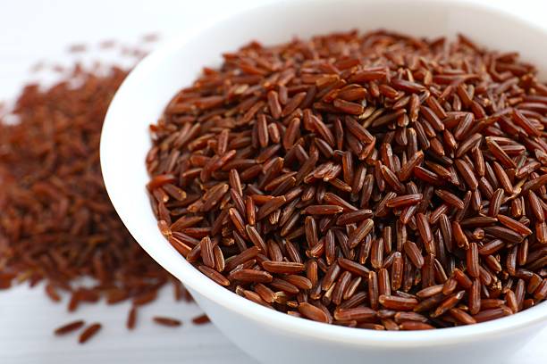 istock Raw brown rice in bowl on the table 2254132688