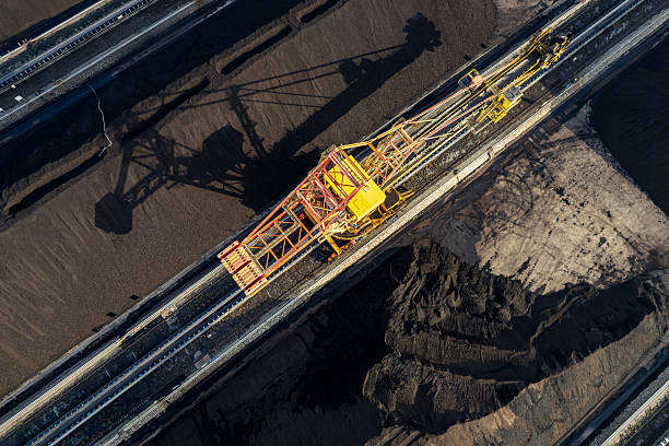 istock The mechanical equipment in the coal field is transporting coal 2254137888
