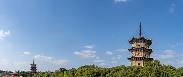 istock On a sunny day, the ancient stone tower between the forest 2254138937