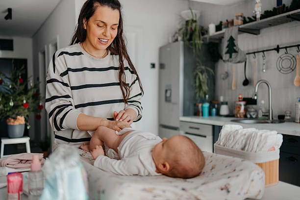 istock Baby in a living room getting diaper changed 2254140256
