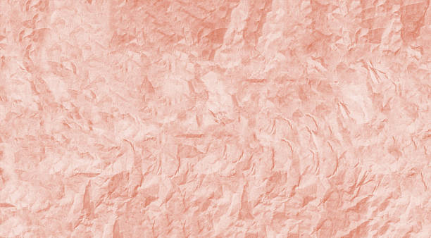 istock Crumpled pink paper texture creating a detailed background 2254140443