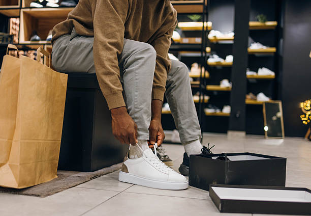 istock A man tries on shoes in a store 2254141353