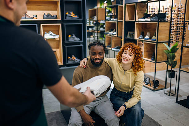 istock Couple buying sneakers in a store 2254141370