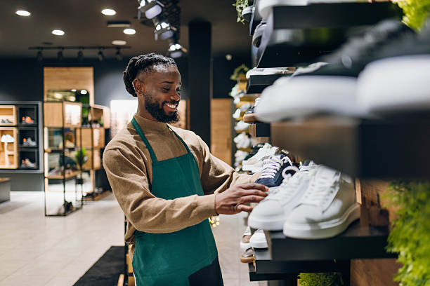 istock Shoe salesman in a store 2254141542