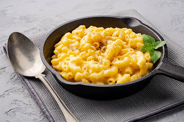 istock Delicious mac and cheese in a pan on grey stone background 2254142030