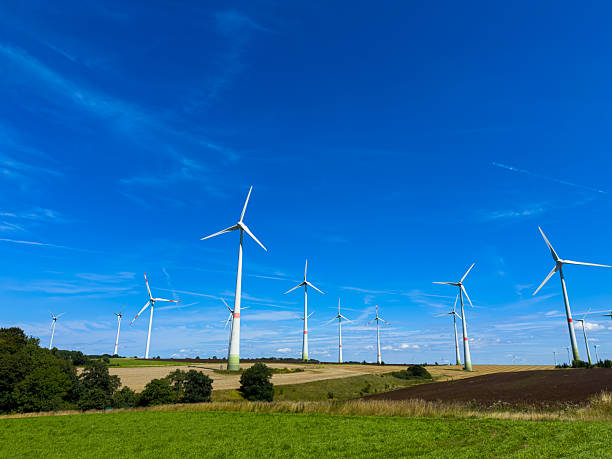 istock This scenic landscape features numerous wind turbines on rolling green hills under a clear blue sky, showcasing the harmony between renewable energy technology and the beauty of nature 2254142809