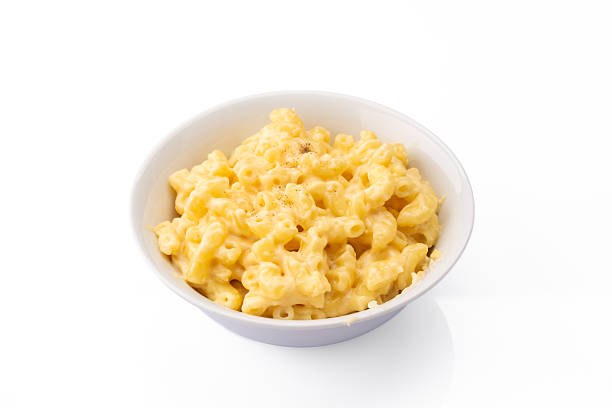 istock Delicious mac and cheese in a bowl on white background 2254142824