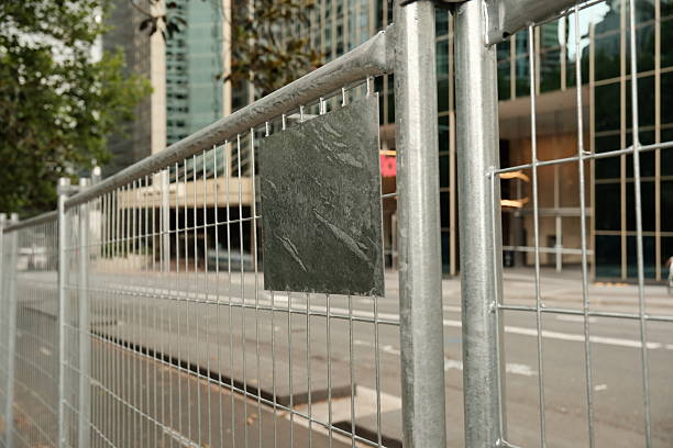 Close-up on the top corner of a metal barricade.