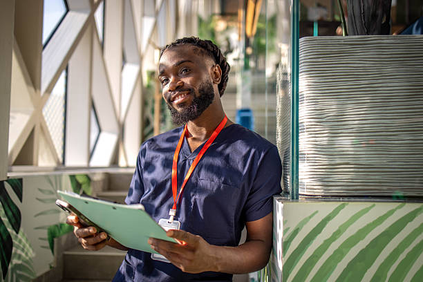istock Medical student using a phone in a cafeteria 2254143283