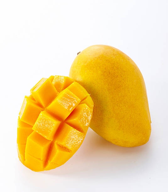 istock A mango and a mango cut into flowers are isolated on a white background. 2254144945