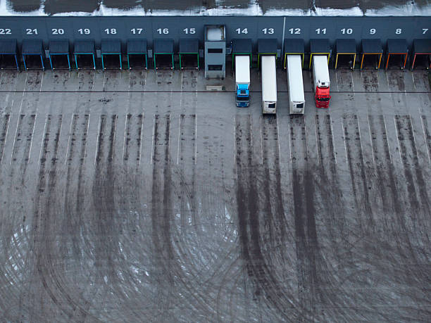 istock Dirt tracks outside the loading docks of a large warehouse 2254147940