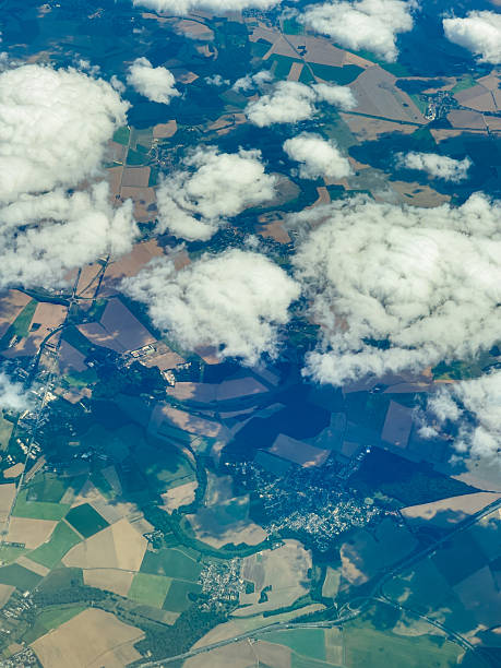 istock Clouds float above green fields and patchwork land during a sunny day over the countryside 2254149007