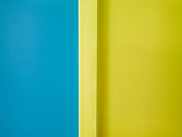 Close up of a blue and yellow plastic storage box background.