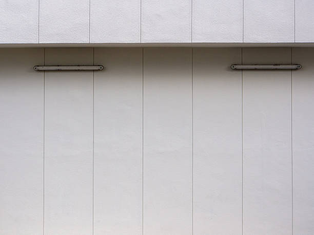 View of some details among the buildings in the Assago district on a gray early winter morning. Milan, Italy