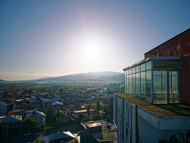 Batumi, Adjara, Georgia - April 02, 2025:  Dense Residential Neighborhood Rooftops Illuminated by Golden Sunset Light