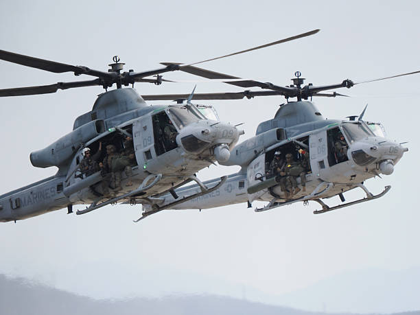San Diego, California, USA - September 28, 2025: Two Bell UH-1Y Venom helicopters flying in tandem formation during a Marine Air-Ground Task Force demonstration.