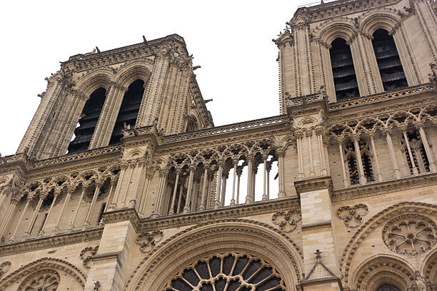 Paris, France: A renovated (2025) Notre Dame Cathedral facade (close-up), with a focus on the top section bell towers.