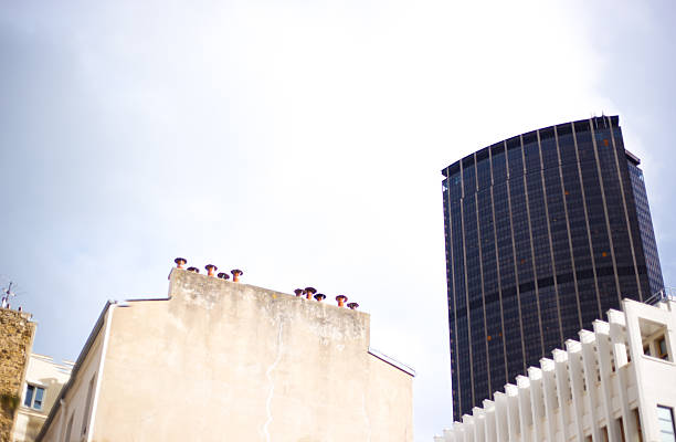 Paris, France: An old building in the foreground and a skyscraper in the background. The foreground is the 11th arrondissement, while the background is the 20th arrondissement near Blvd de Belleville.