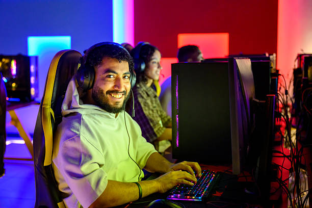 istock Male eSports gamer smiling while playing video game 2254169023