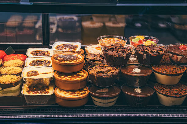 istock Assorted layered desserts displayed in a refrigerated showcase inside a pastry shop 2254171801