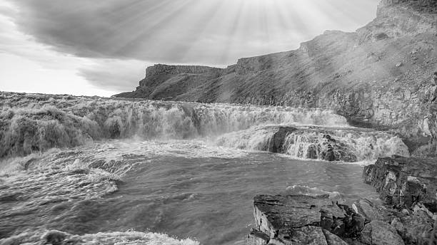 Powerful Gullfoss waterfall in Iceland during summer with rushing water and mist.