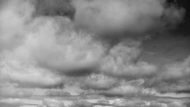Panoramic sky landscape with vibrant blue background and scattered fluffy clouds