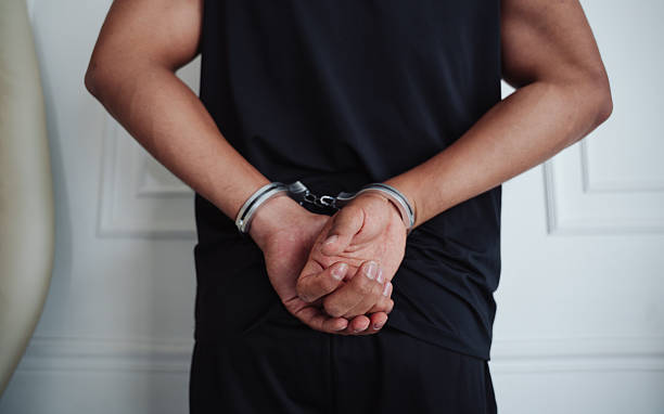 istock young man captured in handcuffs 2254177617