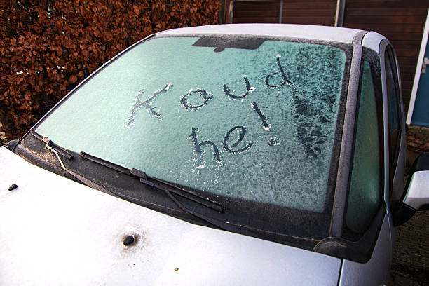 istock Frozen car windshield with Dutch winter expression written in frost 2254178244