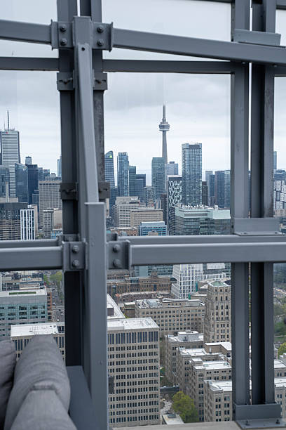istock Toronto Cityscape with CN Tower Viewed Through Industrial Metal Framework 2254186357