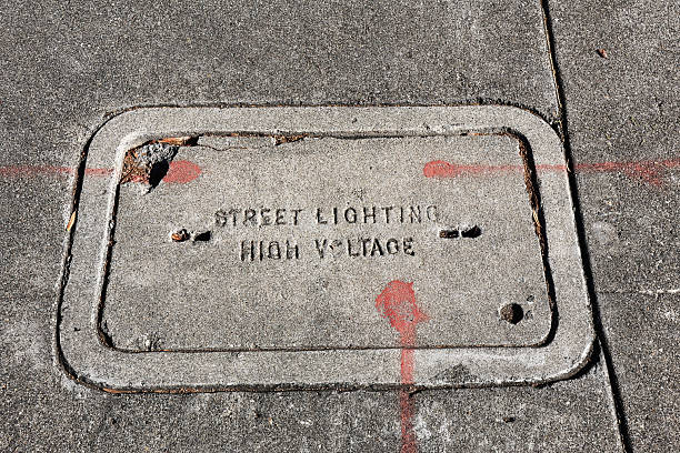 istock Concrete sidewalk utility tile for street lighting with High Voltage cable access 2254190880