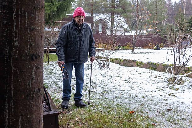 istock Man Working in Winter Garden Bed 2254195881