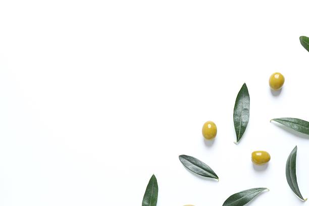 istock Olives and leaves on white background 2254196755