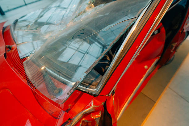 Car accident crash, Car accident protection, Claim collision, Auto emergency. Crashed car claim insurance. Warranty policy service. Serious problems. A red car with a damaged front end.