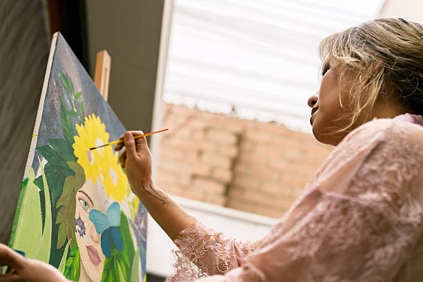istock Visual artist painting vibrant artwork on canvas 2254197144