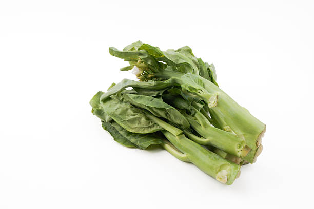 Fresh kailan vegetables isolated on white background representing leafy greens, organic produce, healthy cooking ingredient, and natural food in clean minimal presentation.