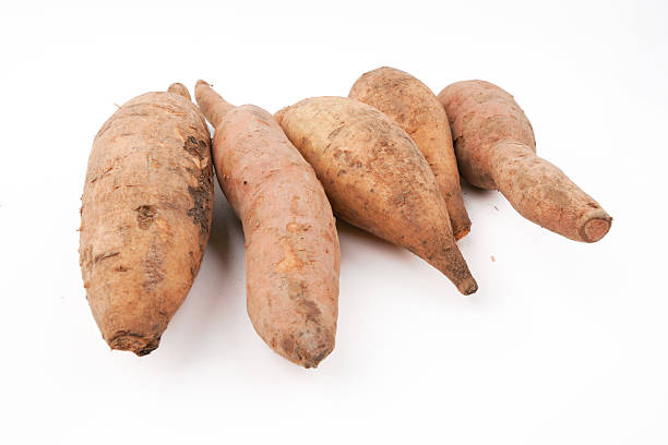 istock Sweet potatoes isolated on white background representing fresh root vegetables, natural farm produce, healthy food ingredient, and everyday cooking staple in clean minimal presentation. 2254197331