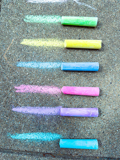 istock Colorful sidewalk chalks create a lively display on the pavement, perfect for outdoor art. Children love using them to express creativity and enjoy limitless artistic play and imagination 2254201200