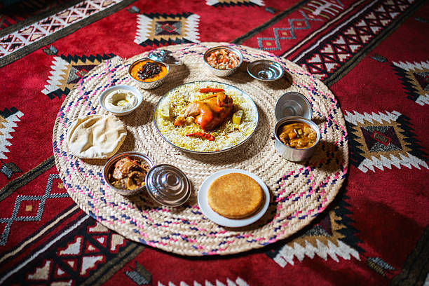 istock Traditional Saudi Rice Dish with Assorted Sides on Carpet 2254203479