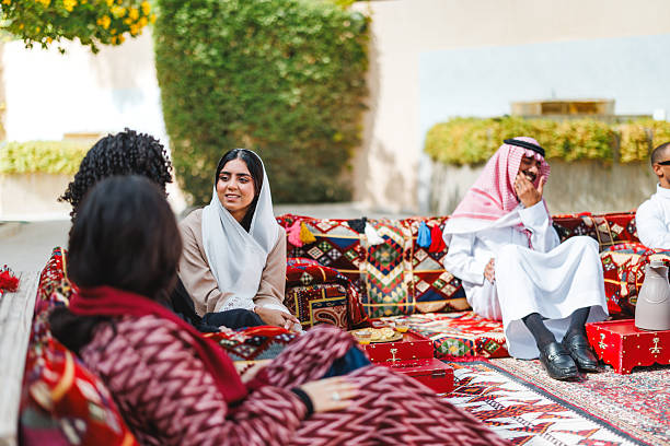 istock Middle Eastern Individuals Engaging in Lively Conversation in Traditional Arabic Majlis Outdoors 2254203547