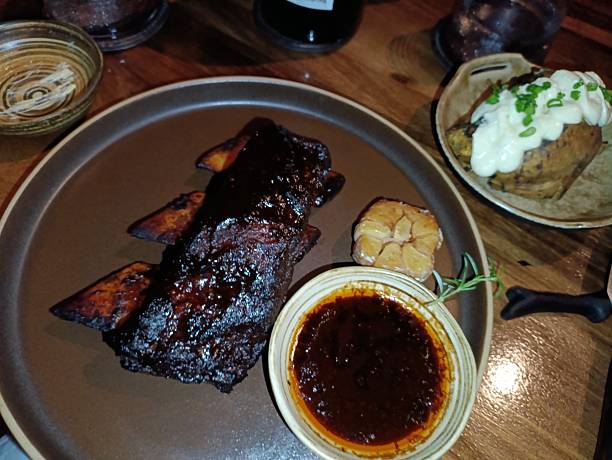istock Beef steak and pork ribs with various sauce and condiments 2254211046