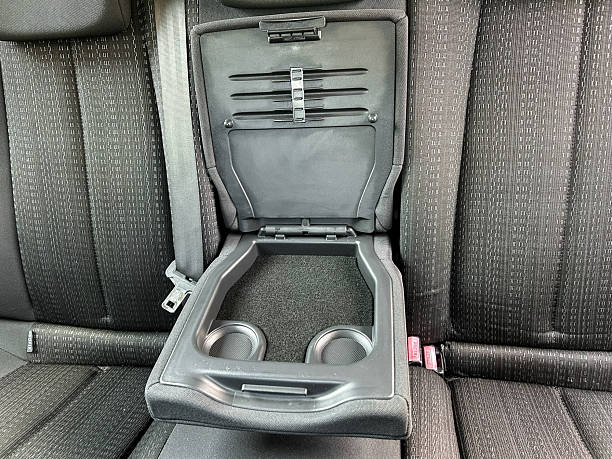 istock Innovative car interior design features a sleek foldable armrest with cup holders and organized storage for modern convenience 2254220458